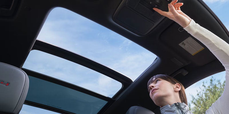 2026 GMC Acadia sunroof view showcasing panoramic glass roof bringing natural light into the premium interior